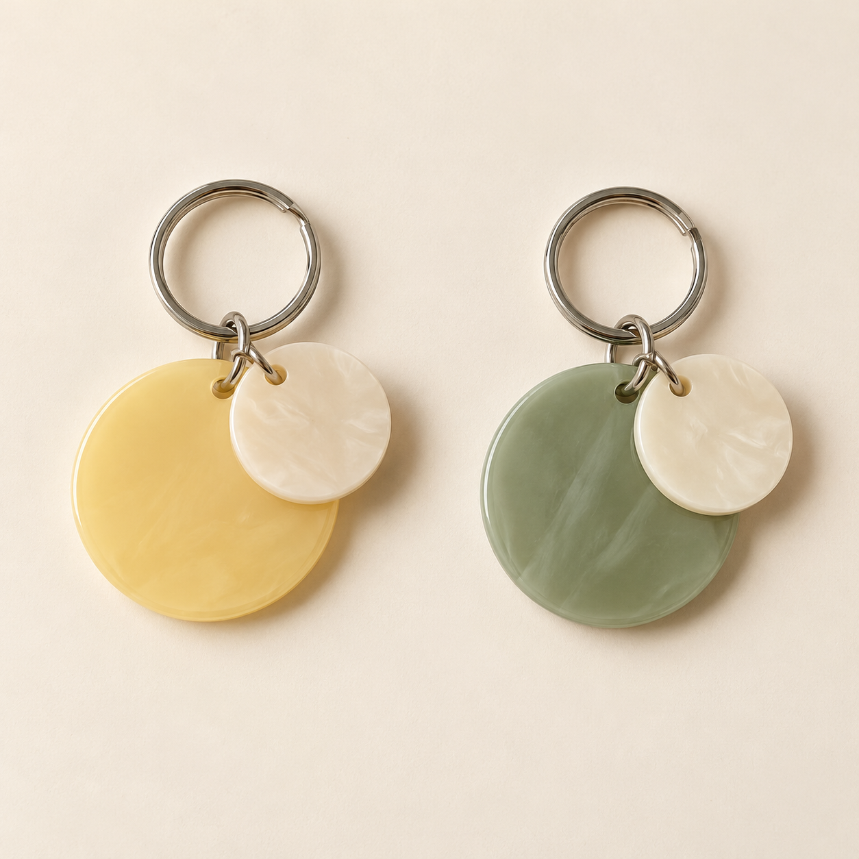 Duo Disc Keychain, shown in Butter & Cream and Sage & Cream