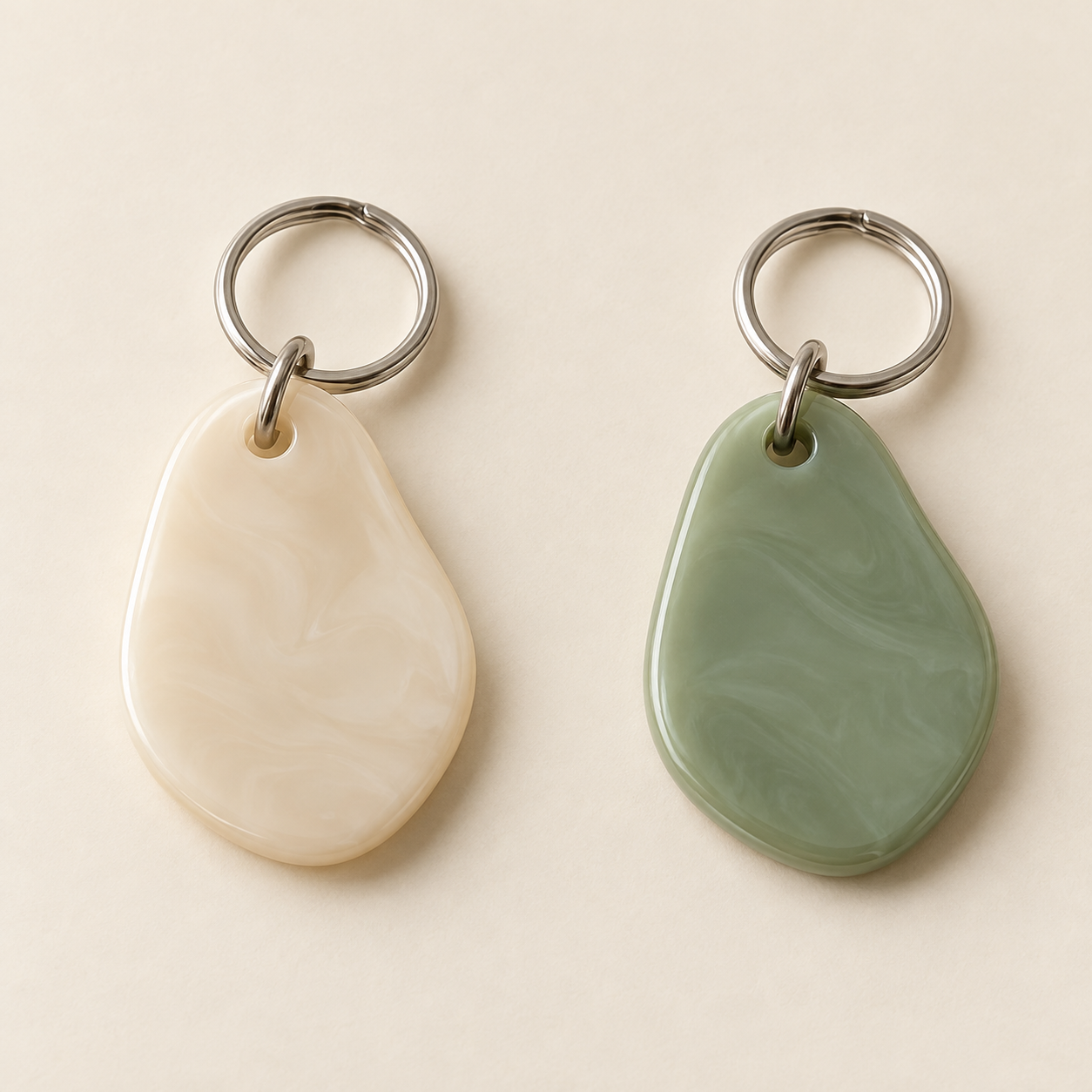 Pebble Key Charm, shown in Cream and Sage