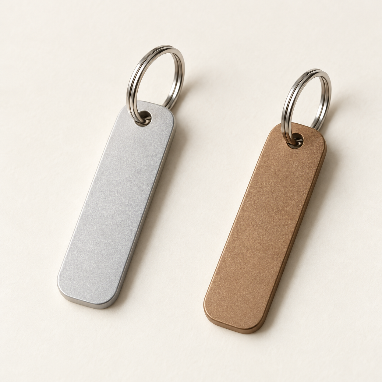 Pillar Metal Key Tag, shown in Silver and Bronze